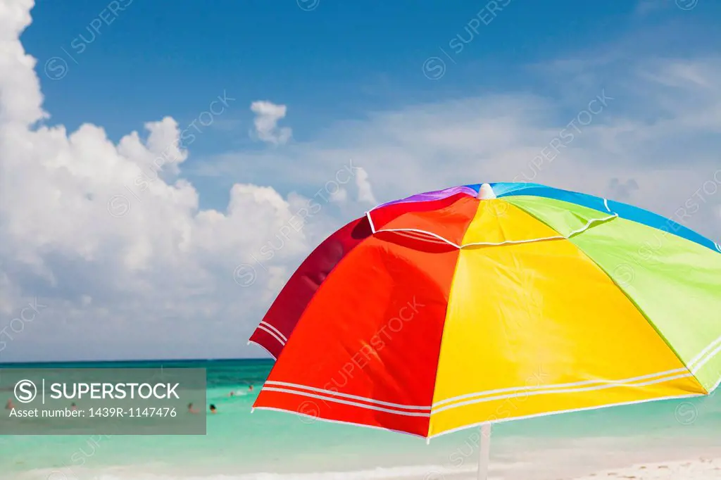 Bright beach umbrella on Playa Del Carmen, Quintana Roo, Mexico