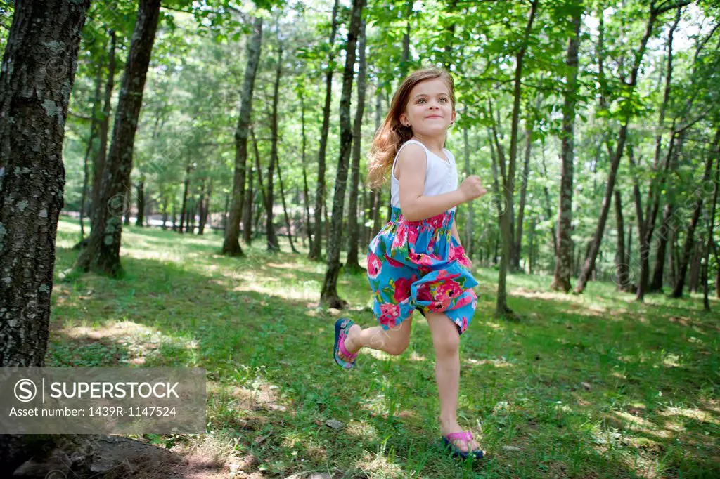 Girl running in forest