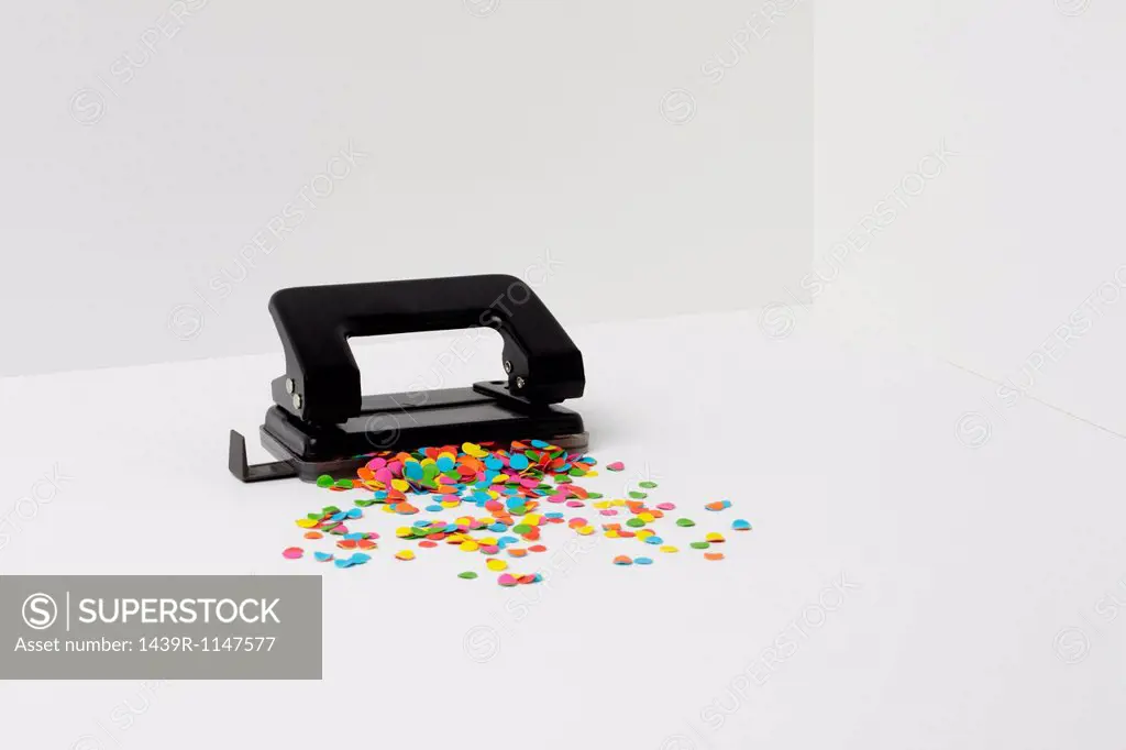 Hole puncher with multi coloured paper