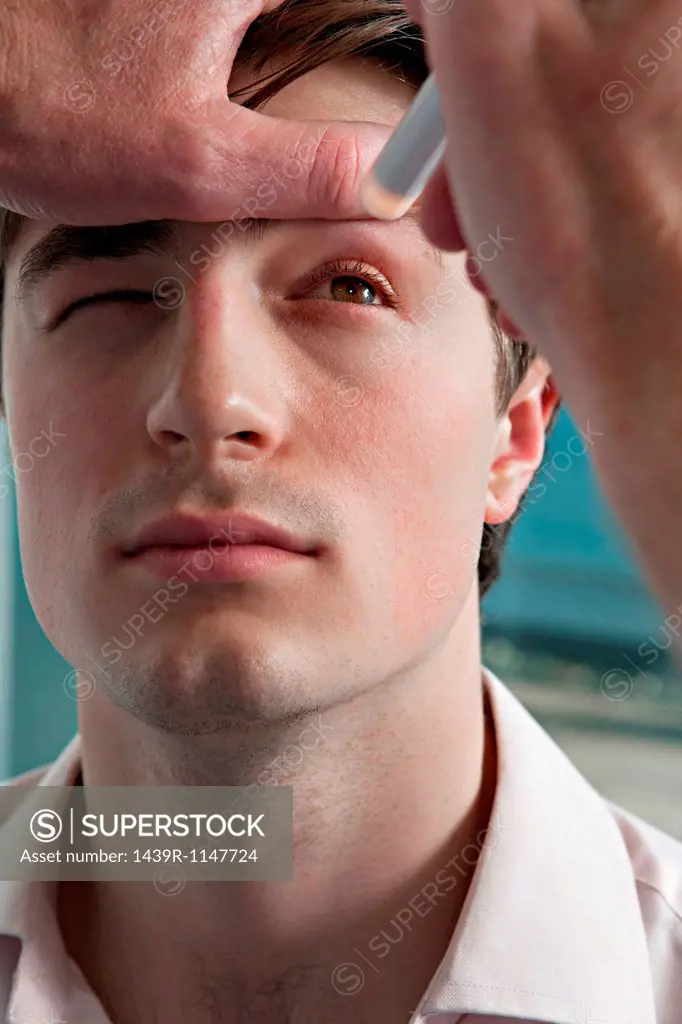 Doctor performing medical examination on patient´s eye