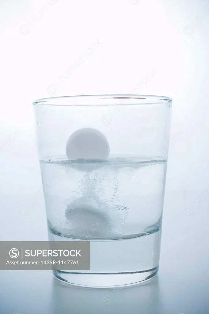 Pill in glass of water