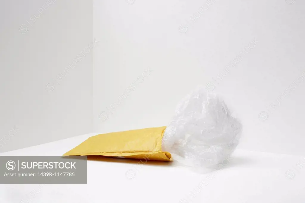 Padded envelope with plastic coming out