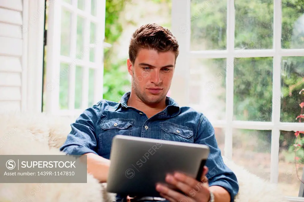 Young man with digital tablet