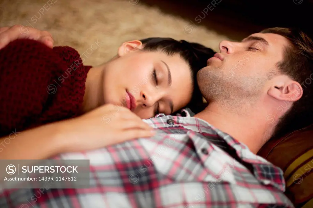 Young couple sleeping, close up