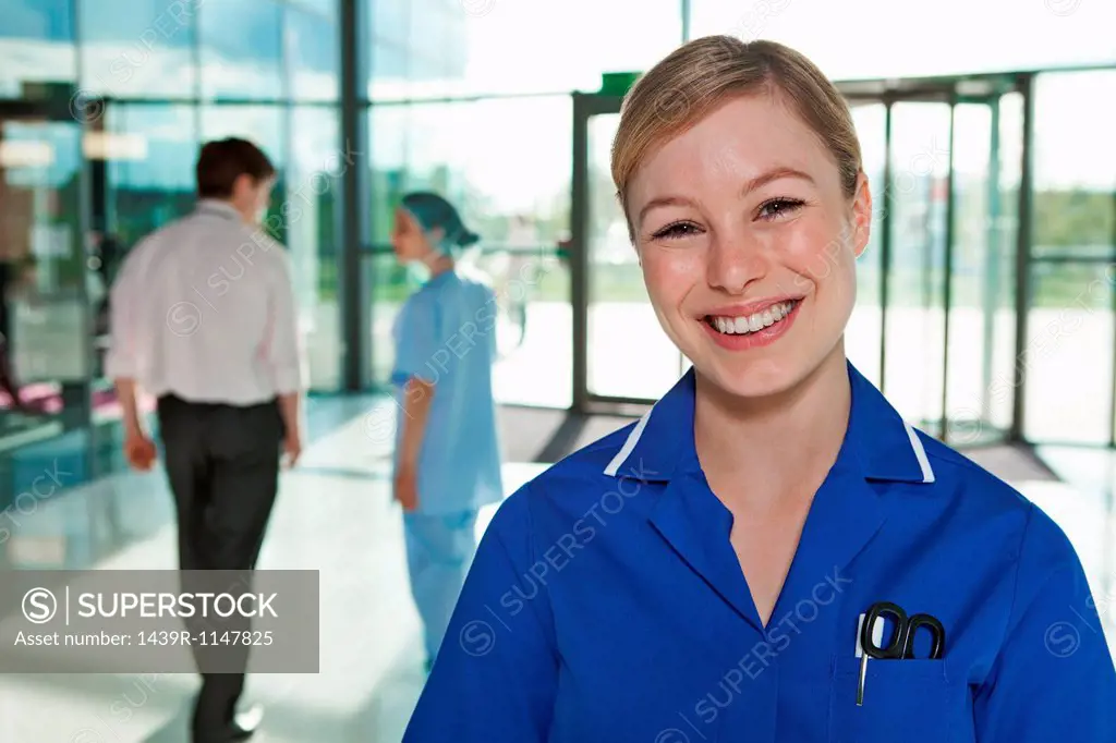 Portrait of nurse in hospital foyer
