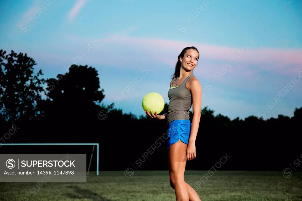 Girl holding soccer ball