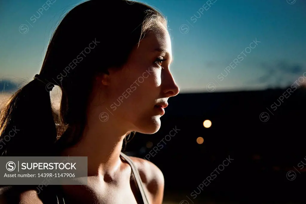 Portrait of girl looking away, at night