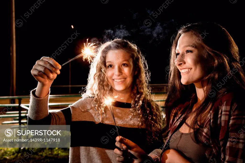 Friends holding sparklers