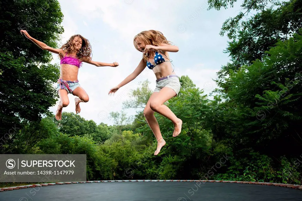 Two girls on trampoline