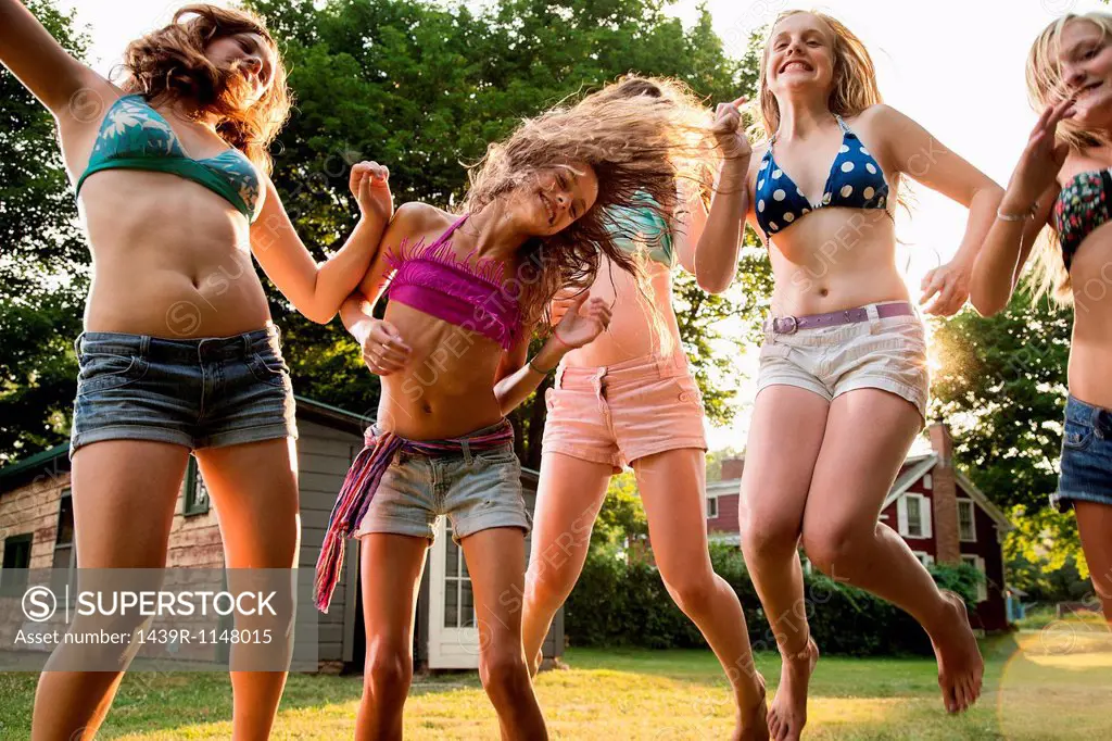 Girls dancing in garden