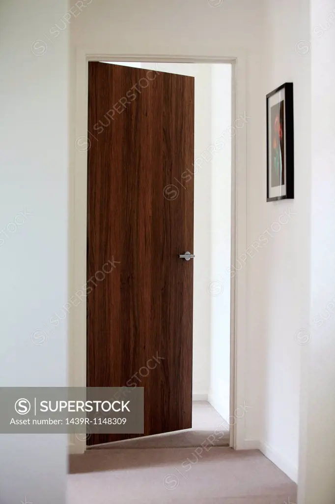 Open door leading off hallway