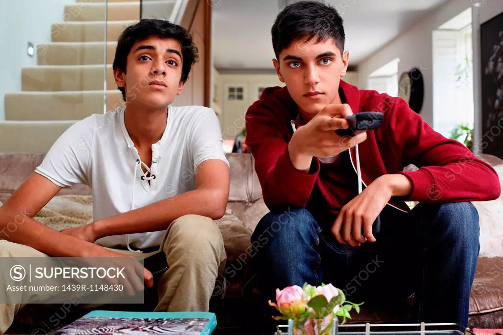 Teenage boys watching television
