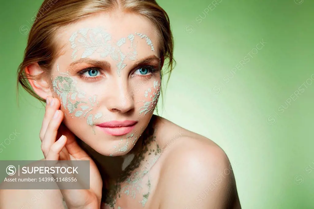 Womans face decorated with face mask