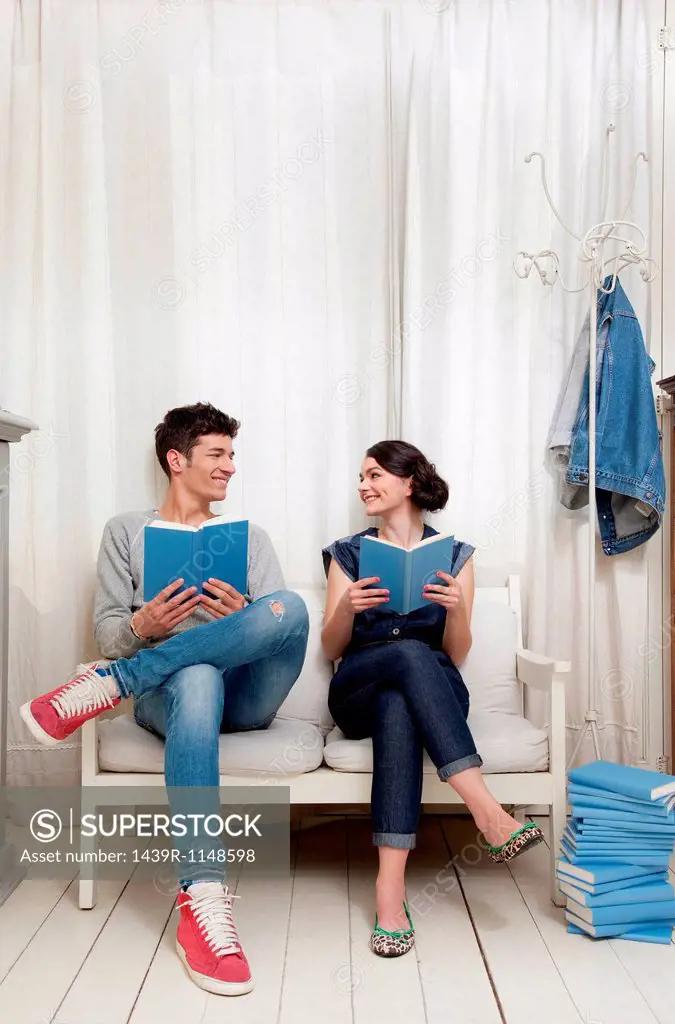 Couple holding books