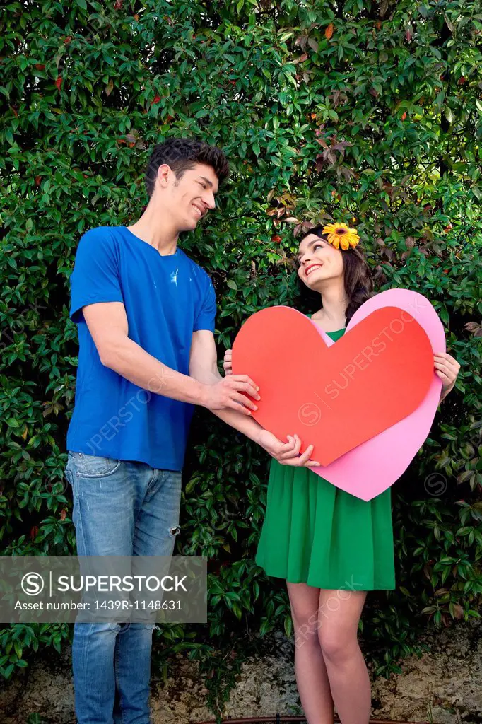 Couple holding heart shape