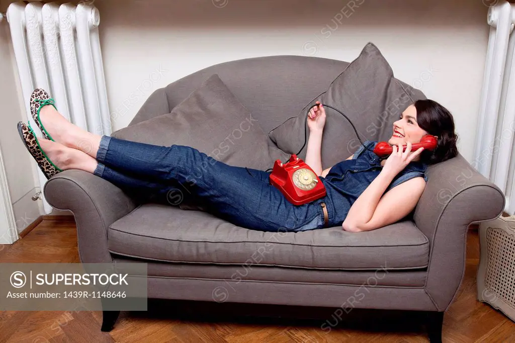 Woman on sofa on the phone