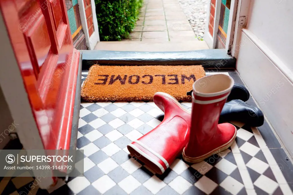 Welcome mat and wellington boots
