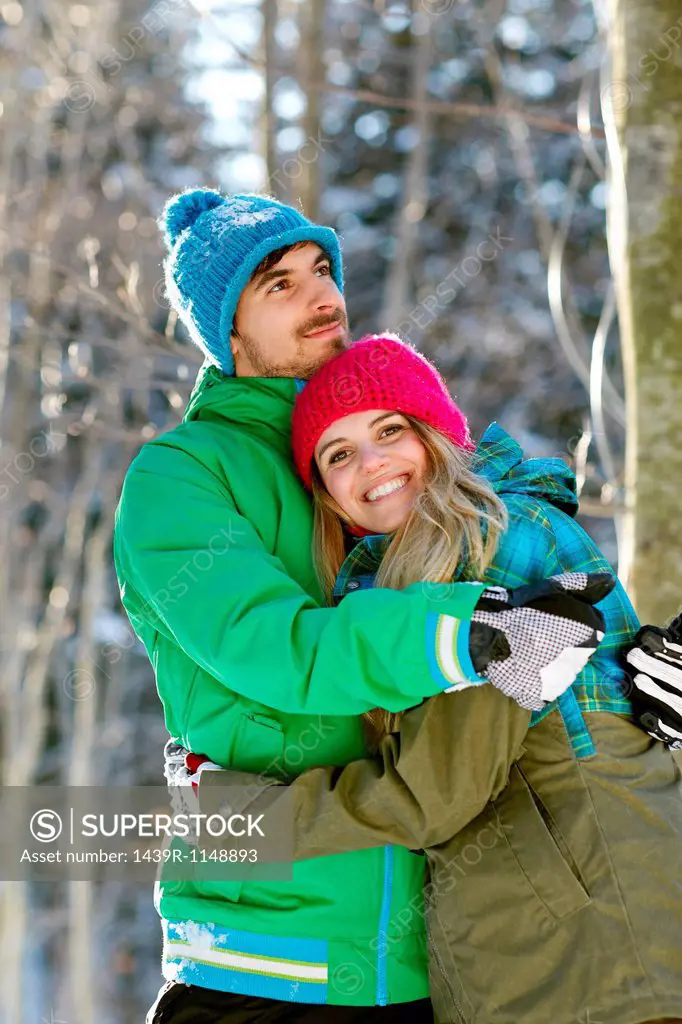 Portrait of couple hugging, wearing winter clothes