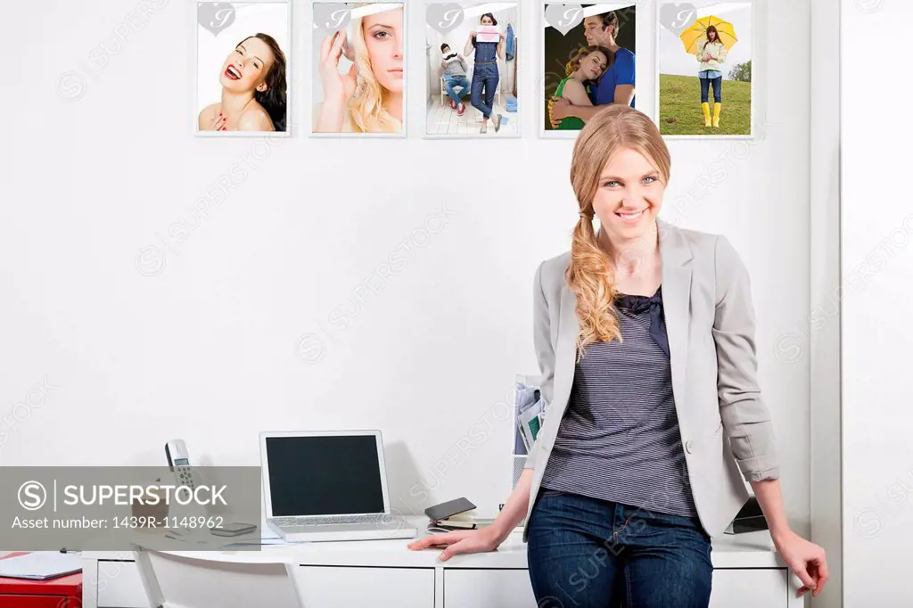 Confident young woman in magazine office