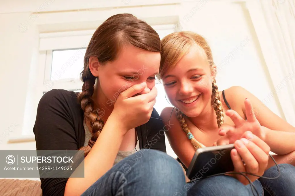 Two girls using smartphone