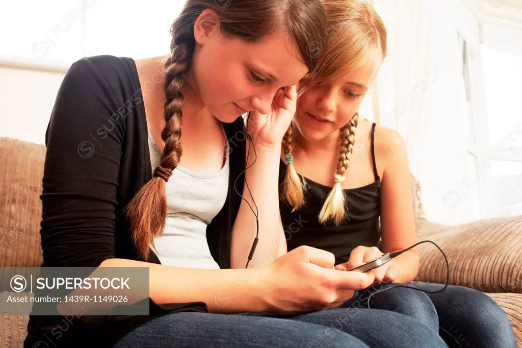 Two girls using smartphone