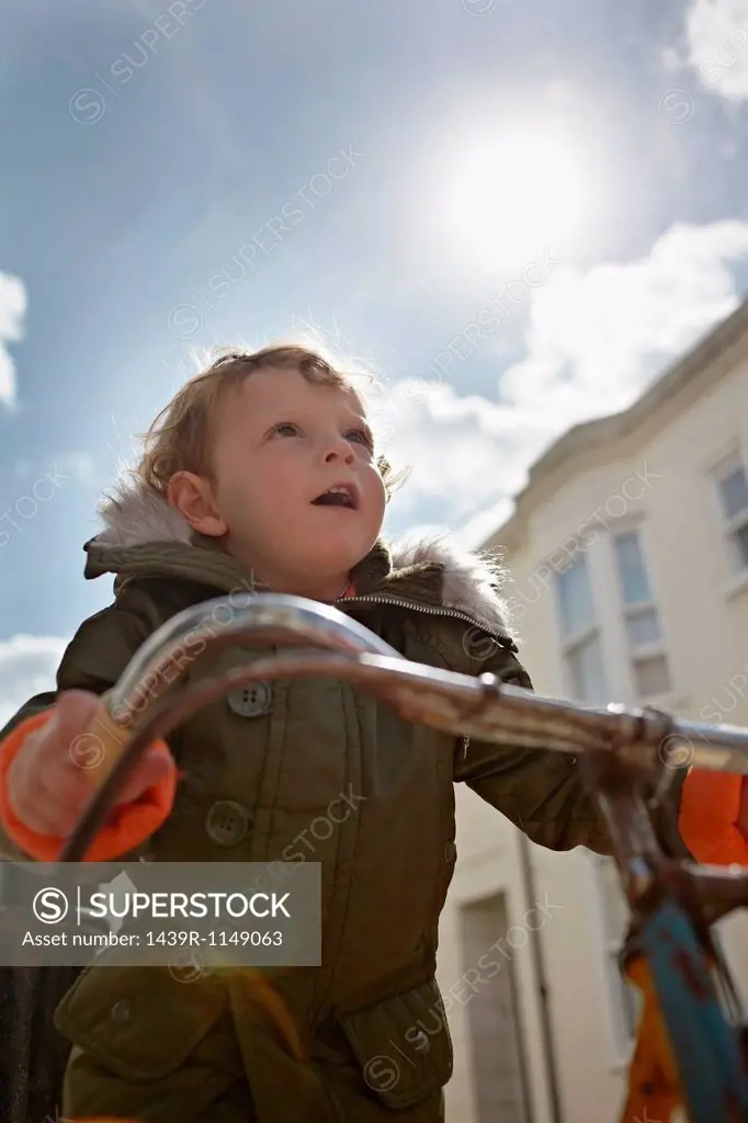 Mod toddler boy on retro bicycle