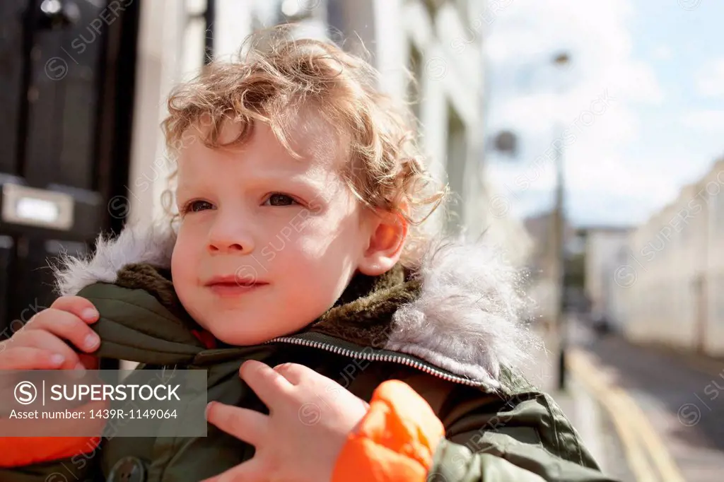 Little boy outdoors, wearing parka