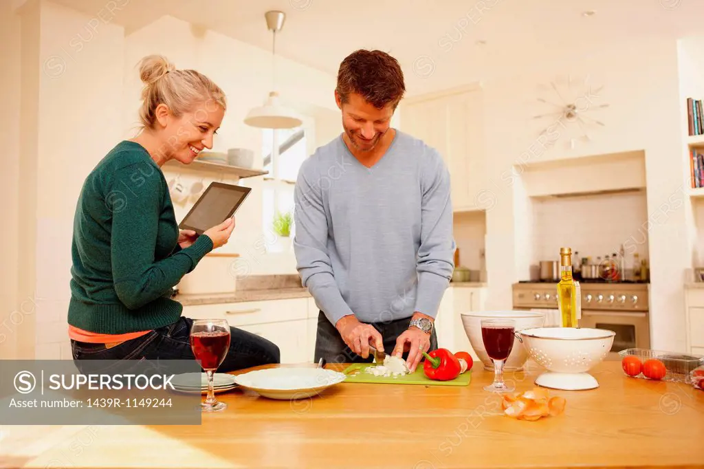 Couple preparing food in kitchen