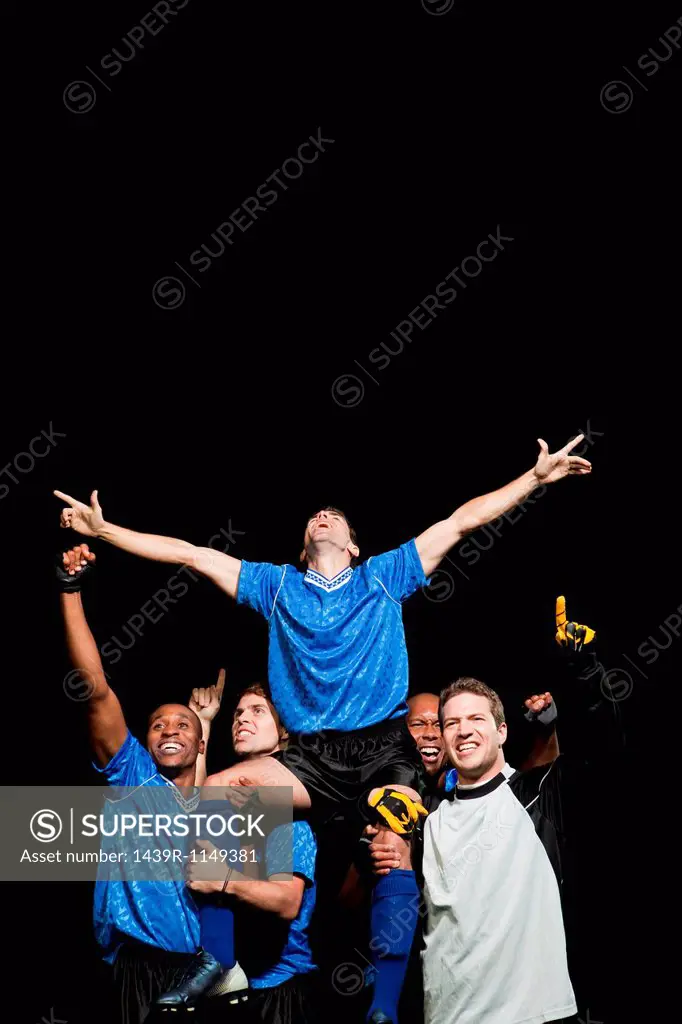 Soccer team celebrating victory