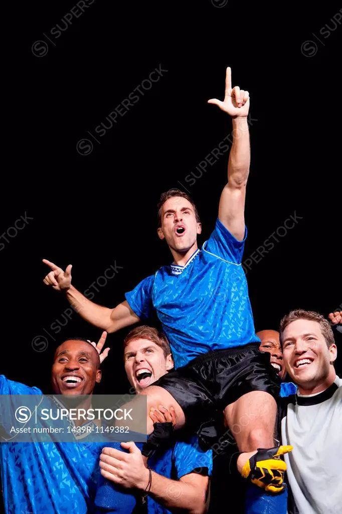Soccer team celebrating victory
