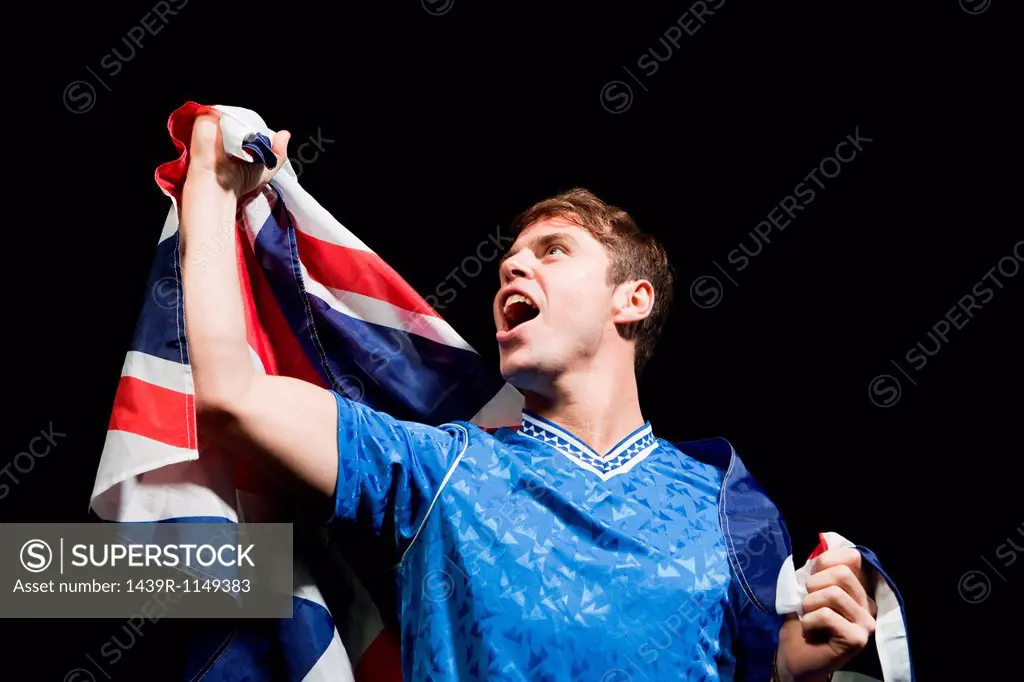 Soccer player holding Union flag