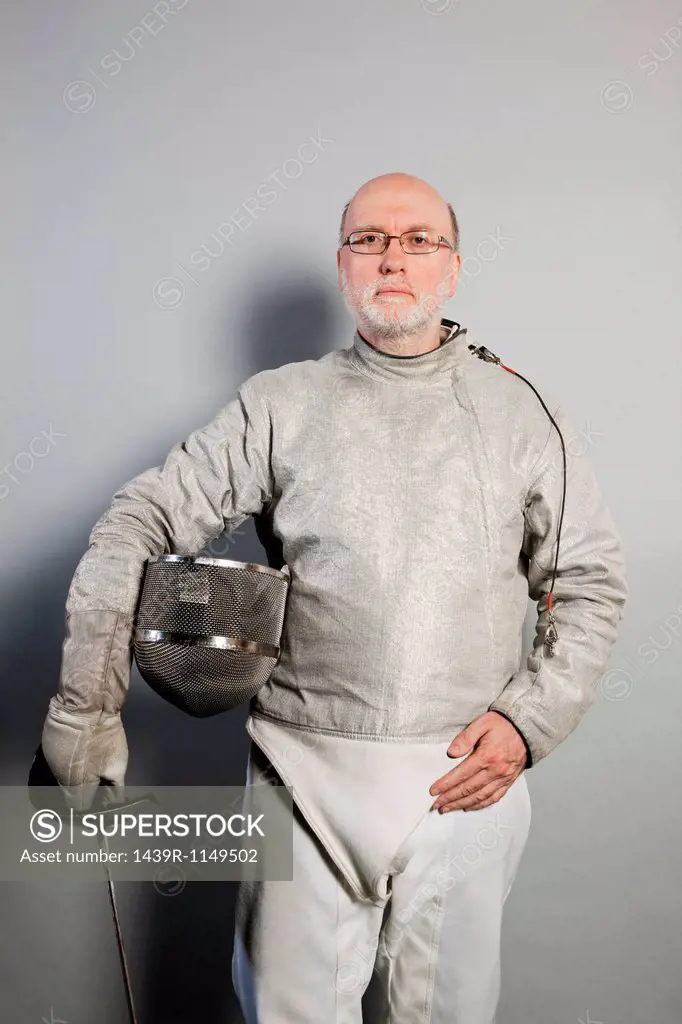 Portrait of senior man in fencing suit