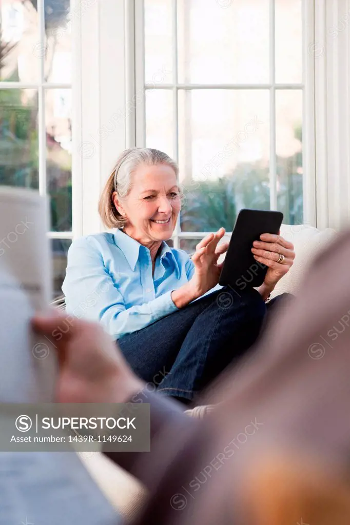 Senior woman using electronic book