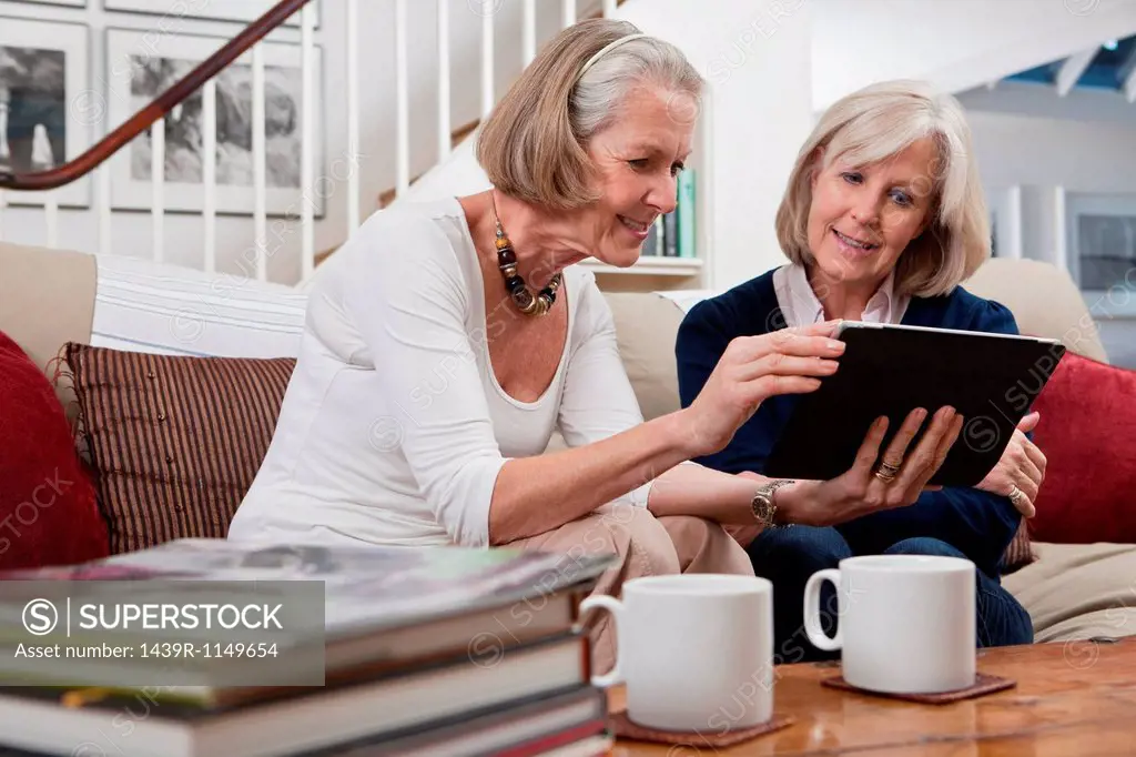 Senior women looking at digital tablet