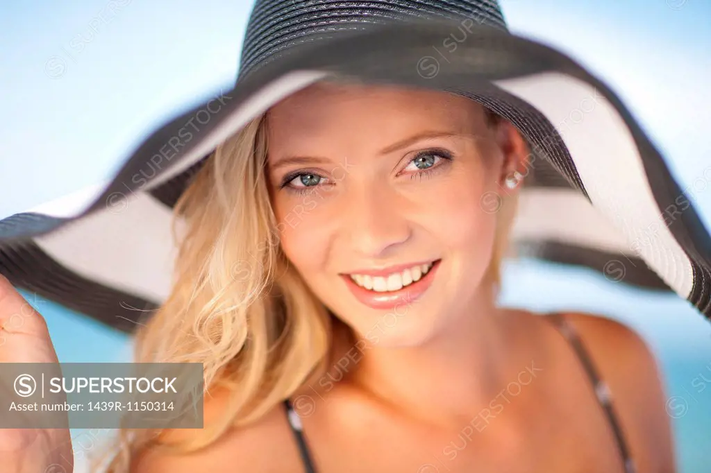 Woman wearing floppy hat outdoors