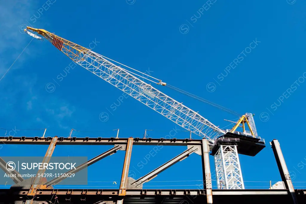 Low angle view of crane at construction site