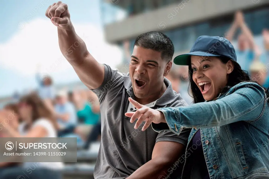 Excited couple at sports game