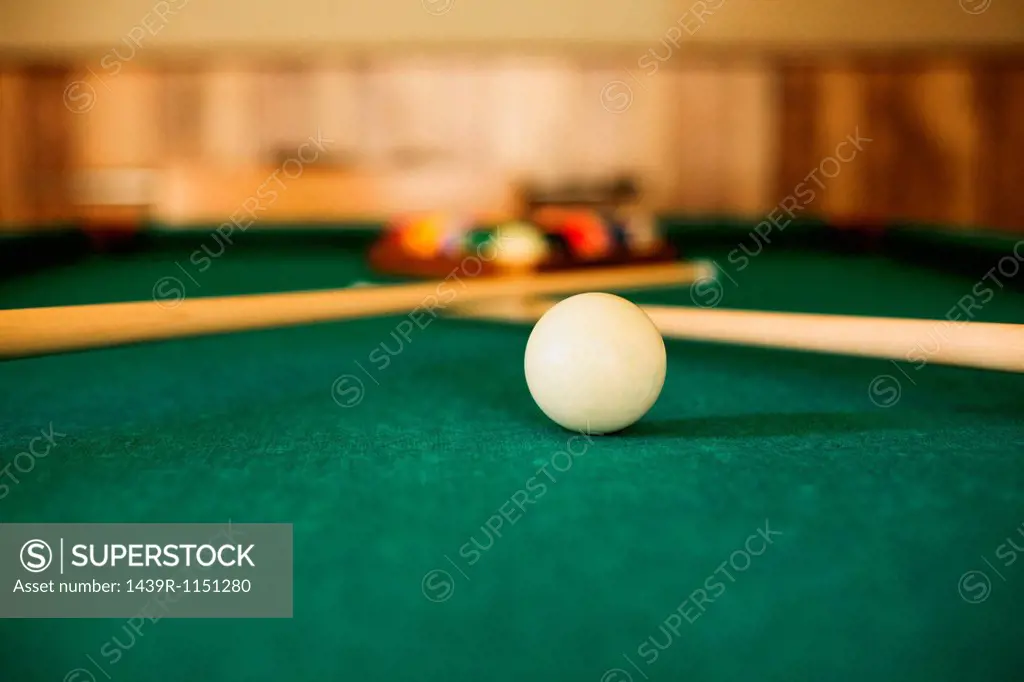 Close up of cue ball on pool table