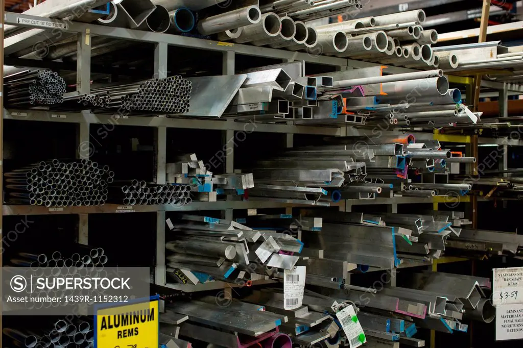Shelves of aluminum pipes in plant