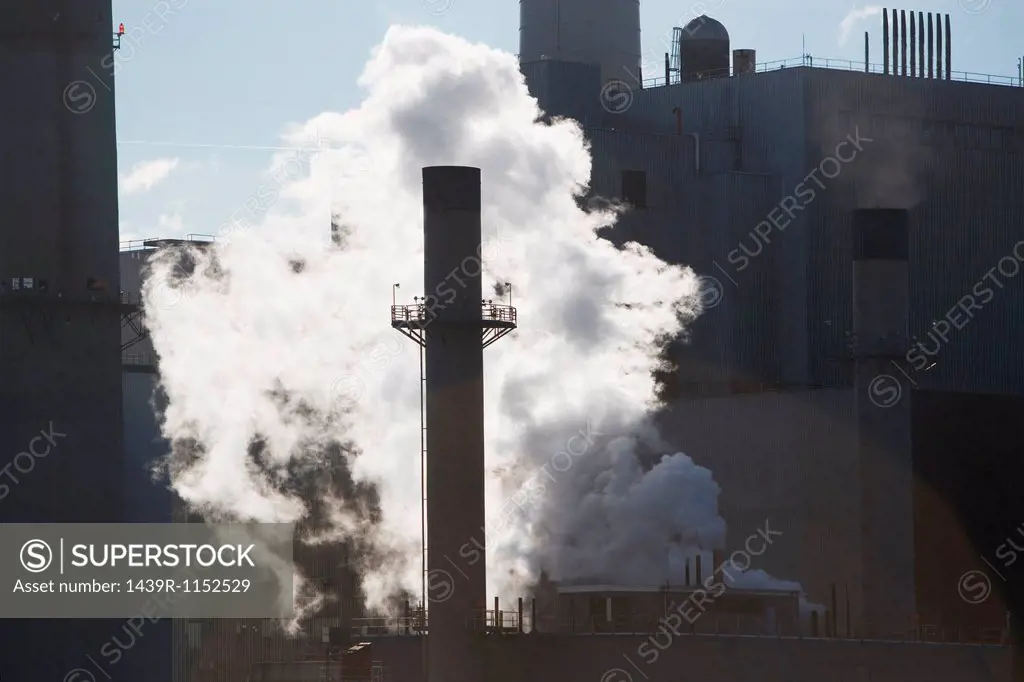 Steam from factory smokestack