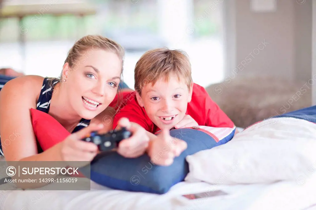 Woman and boy playing computer games