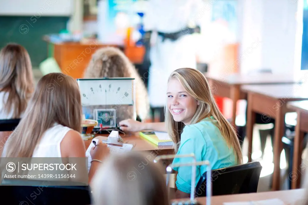 Girl turning around to look at her classmates
