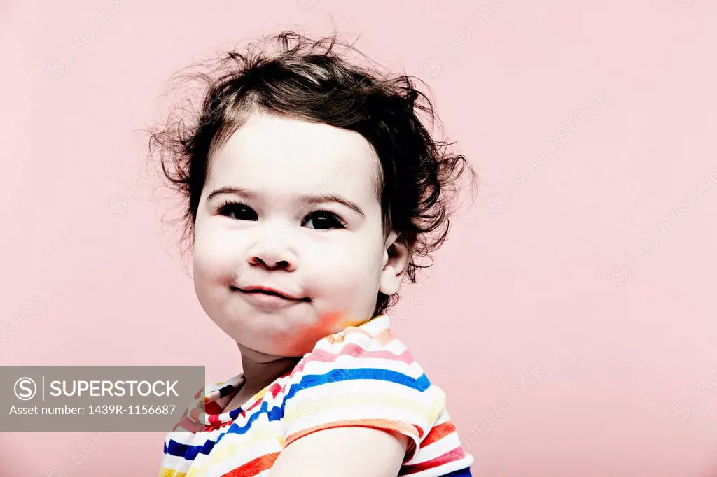 Portrait of baby girl wearing striped top