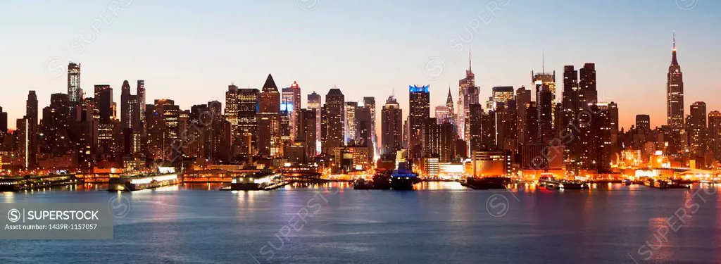 Panoramic view Manhattan skyline and waterfront at dusk, New York City, USA