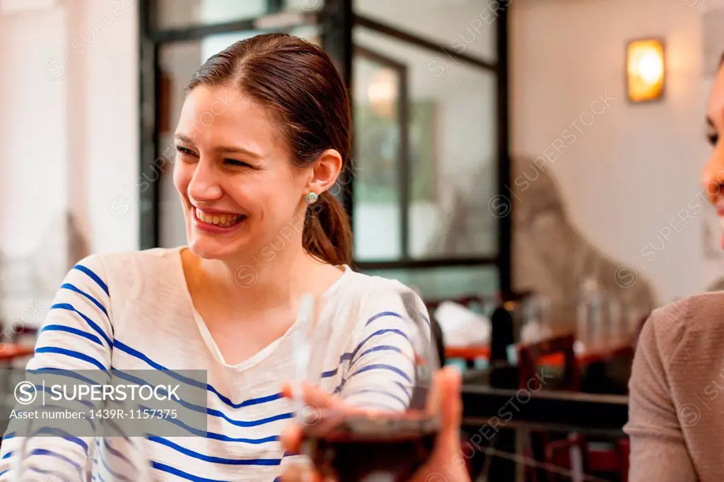 Woman enjoying herself at wine bar