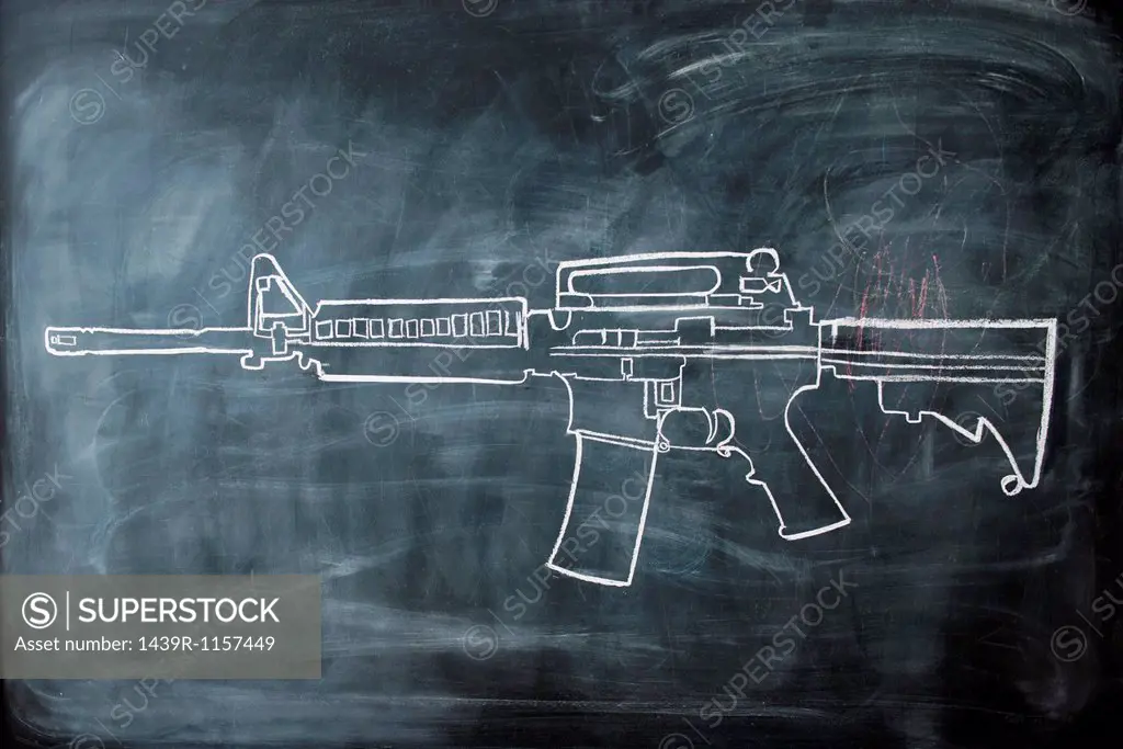 Chalk drawing of gun on blackboard