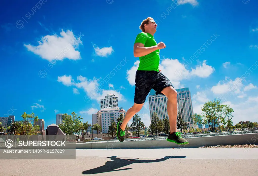Young man jogging in city