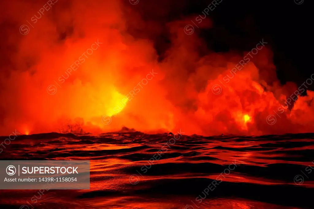 Lava flow into sea at night, Kilauea volcano, Hawaii