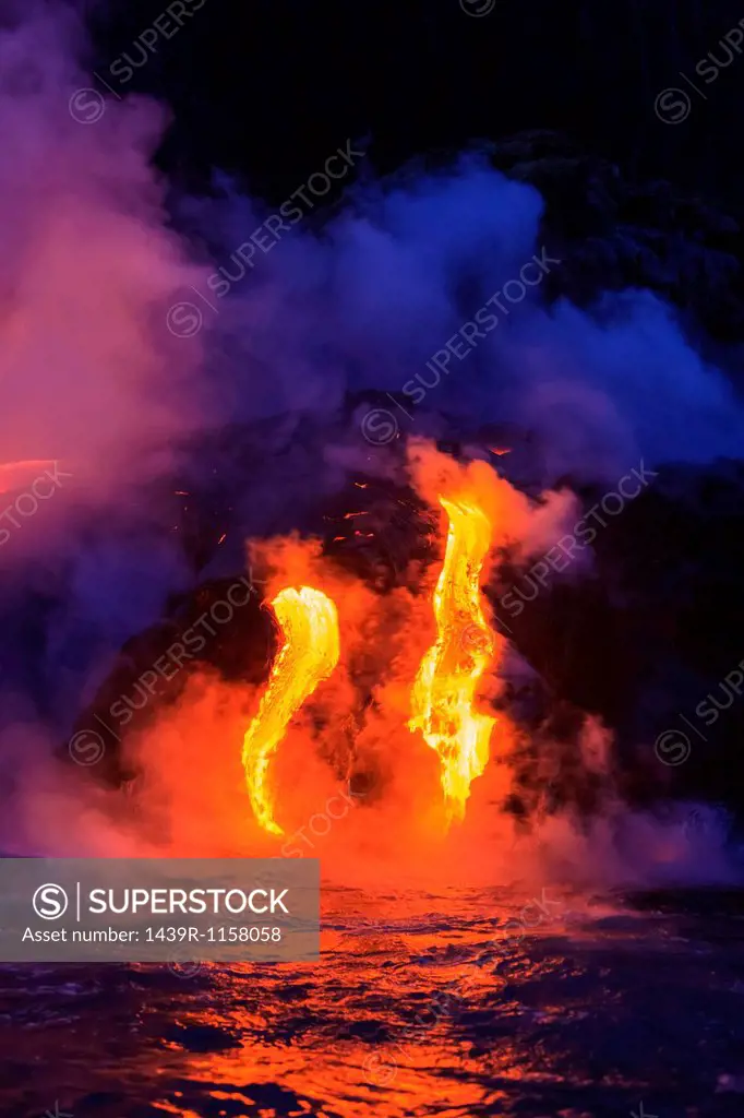 Lava flow impacting sea at dusk, Kilauea volcano, Hawaii