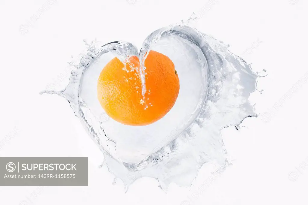 Orange splashing in liquid